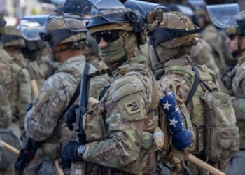 Soldiers stand in Los Angeles as they regulate protests on June 12, 2025.