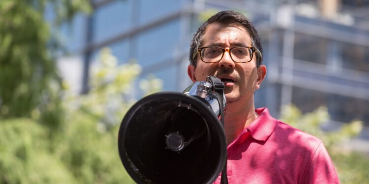 Jose Garza speaks during #CloseTheCamps: MoveOn, United We Dream, American Friends Service Committee, and Families Belong Together led protests across the country at members of Congress' offices to demand the closure of immigrant detention centers.
