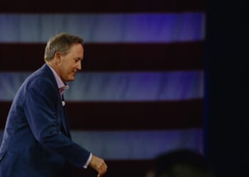 Texas Attorney General Ken Paxton leaves CPAC stage.