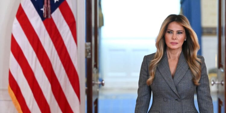 First Lady Melania Trump arrives in the White House Cross Hall in Washington, D.C., on April 9, 2026, ahead of a statement denying any links to the late convicted sex offender Jeffrey Epstein and his abuse.