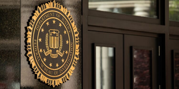 The Department of Justice emblem on an entrance wall to the DOJ Headquarters in Washington D.C.