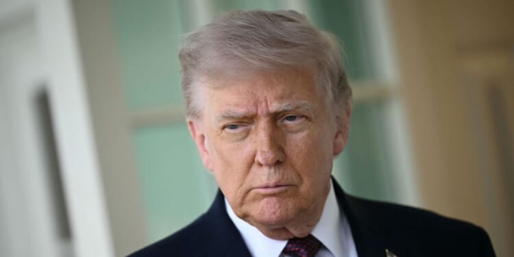 President Donald Trump speaks to reporters outside the Oval Office of the White House in Washington, DC on April 13, 2026.