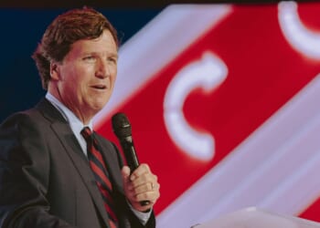 Conservative political commentator and podcast host Tucker Carlson speaks at Turning Point's annual AmericaFest conference, in remembrance of late right-wing political activist Charlie Kirk, in Phoenix, Arizona, on Dec. 18, 2025.