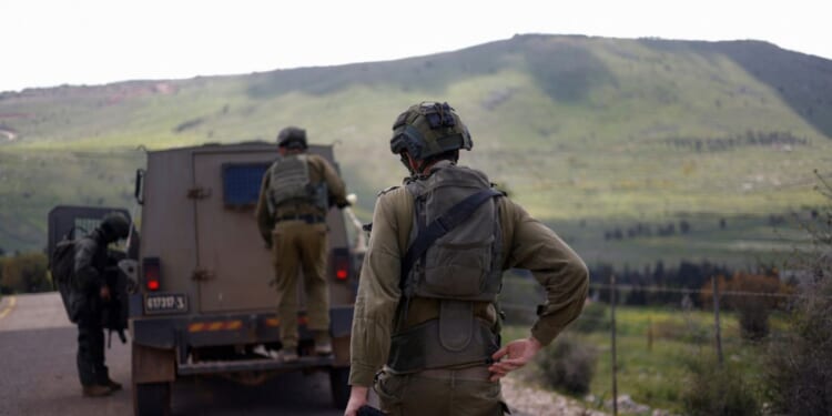 Israeli soldiers patrol along the Israel-Lebanon border on April 10, 2026.