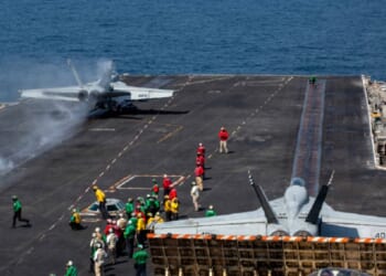 An F/A-18E Super Hornet prepares to launch from the flight deck of the USS Abraham Lincoln at the beginning of Operation Epic Fury, the attack on Iran, on Feb 28.