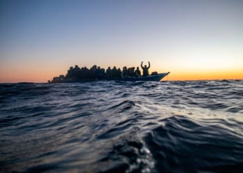 Aid group says Libyan-linked vessels fired on a migrant rescue ship in the Mediterranean