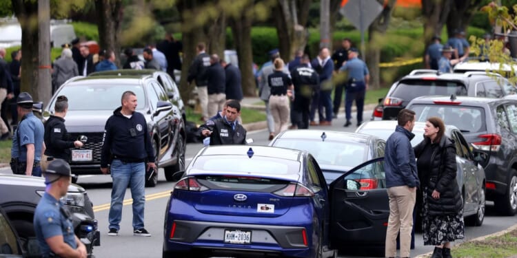 Man with an assault rifle sprays rounds at drivers near Boston, wounding 2 before being shot