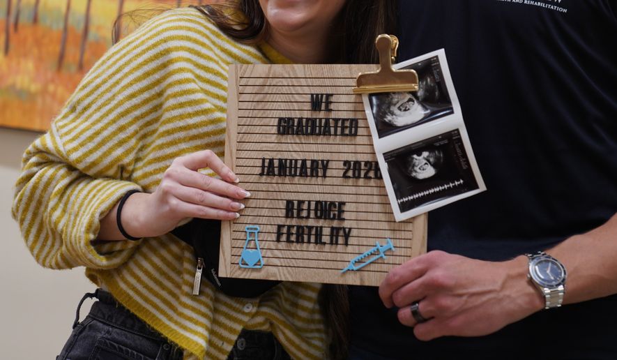 IVF patients Maggie and Cade Lichfield take a photo after getting their final ultrasound at Rejoice Fertility, Jan. 9, 2026, in Knoxville, Tenn. (AP Photo/Jessie Wardarski)