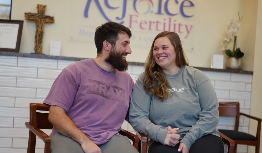 IVF patients Domenic and Olivia D'Agostino sit for a portrait at Rejoice Fertility, Jan. 8, 2026, in Knoxville, Tenn. (AP Photo/Jessie Wardarski)