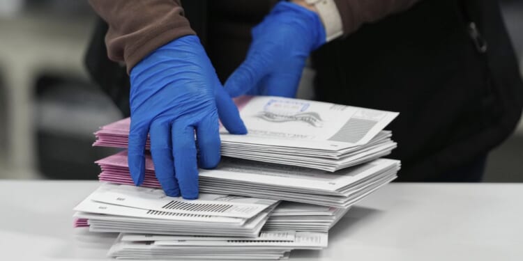 Postal service reveals plan to enforce Trump’s citizenship voting order