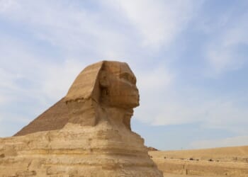 Tourists ride camels near the Sphinx and the Pyramid of Khafre or Chephren, a UNESCO World Heritage site, in Giza on the outskirts of Cairo, Egypt, on Feb. 25, 2025.