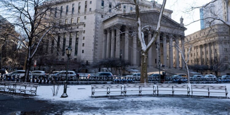 The New York Supreme Court is surrounded by cars on a snowy day on January 19, 2026.