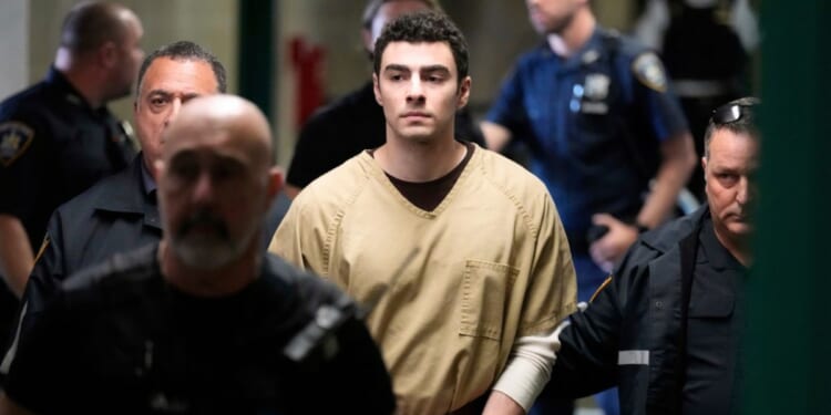 Luigi Mangione is escorted into the Manhattan state courthouse in New York on Sept. 16, 2025.