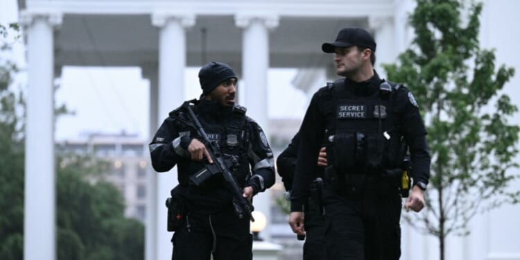 Secret Service Agents patrol outside the White House in Washington after shots were fired nearby, prompting a lockdown on May 23, 2026.