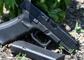 A gun is photographed as it lays on the ground in Richmond, Virginia on July 7, 2021.