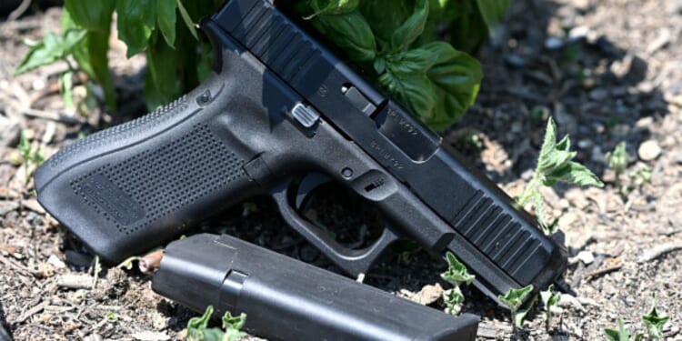 A gun is photographed as it lays on the ground in Richmond, Virginia on July 7, 2021.