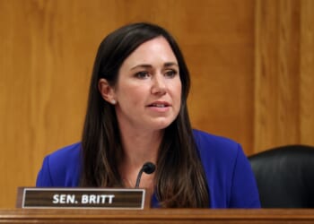 Sen. Katie Britt, seated