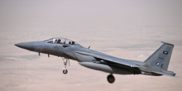 A Saudi fighter jet escorts Air Force One into Riyadh on May 13, 2025.