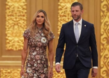 Eric Trump, right, and his wife Lara arrive at a state dinner for President Donald Trump and Chinese President Xi Jinping at the Great Hall of the People on Thursday in Beijing.