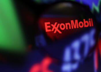 A graphic with red ExxonMobile against dark background.