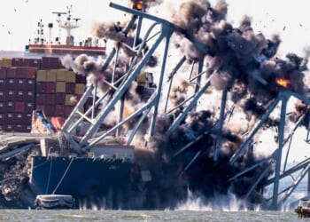 A crew conducts a controlled demolition of debris from the Francis Scott Key Bridge after the Dali container ship crashed into it in Baltimore on May 13, 2024.