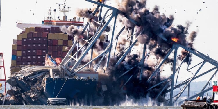 A crew conducts a controlled demolition of debris from the Francis Scott Key Bridge after the Dali container ship crashed into it in Baltimore on May 13, 2024.