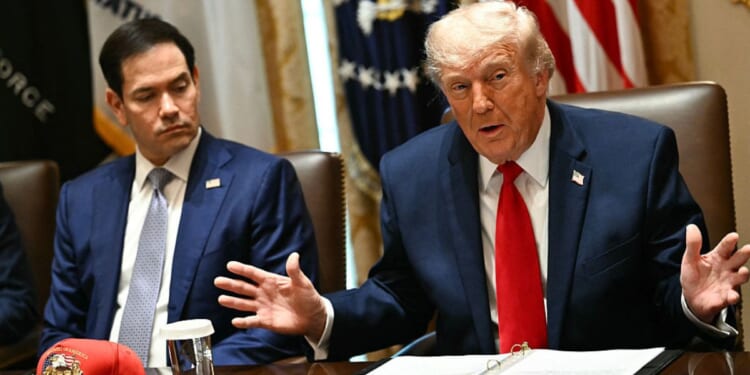 President Donald Trump speaks alongside Secretary of State Marco Rubio during a cabinet meeting Wednesday at the White House in Washington, D.C.