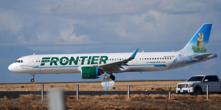 A Frontier plane can be seen as it taxis down the runway preparing for takeoff on November 25, 2025.