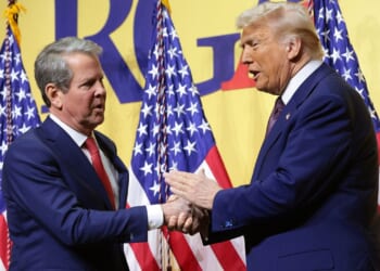 President Donald Trump and Ga. Gov. Brian Kemp shaking hands