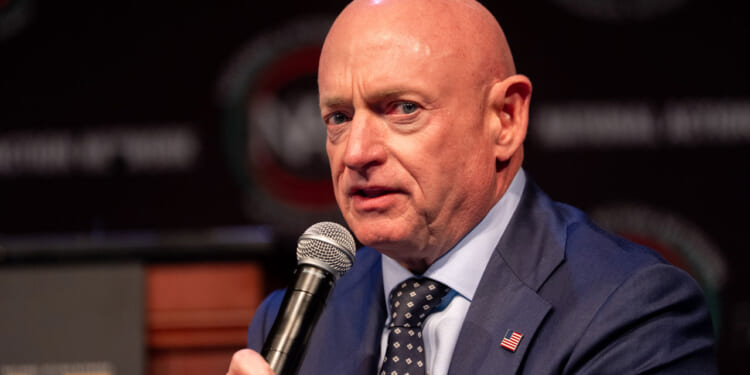 Mark Kelly speaks on a panel.
