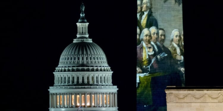 The United States Capitol Building flanks the Washington Monument on December 31, 2025.