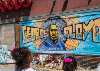Jordan and Royal Pacheco learn of George Floyd's murder at the intersection of 38th Street and Chicago Avenue, ahead of former Minneapolis police officer Derek Chauvin's sentencing, on June 25, 2021, in Minneapolis, Minnesota.