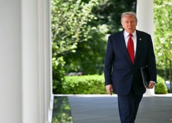 President Donald Trump exits the Oval Office and arrives to speak during a Mother's Day luncheon in the Rose Garden of the White House in Washington, D.C., on May 8, 2026.