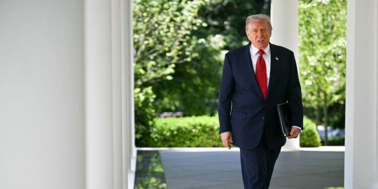 President Donald Trump exits the Oval Office and arrives to speak during a Mother's Day luncheon in the Rose Garden of the White House in Washington, D.C., on May 8, 2026.