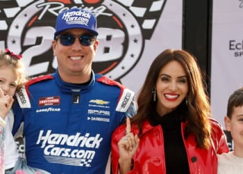 NASCAR champion Kyle Busch poses with his family after winning the NASCAR Craftsman Truck Series Fr8 Racing 208 at Echo park Speedway on Feb. 21, 2026 in Hampton, Georgia.