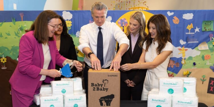 Elizabeth Landsberg, Kim Johnson, Gavin Newsom, Kelly Sawyer Patricof, and Norah Weinstein fill diaper boxes at the Baby2Baby x Golden State Start event at Children’s Creativity Museum on May 8, 2026, in San Francisco, California.
