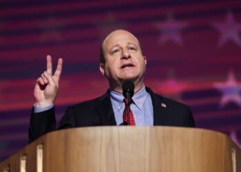 Colorado Gov. Jared Polis speaks on stage during the third day of the Democratic National Convention at the United Center on Aug. 21, 2024, in Chicago, Illinois.