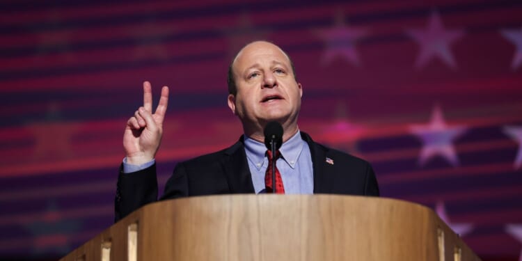 Colorado Gov. Jared Polis speaks on stage during the third day of the Democratic National Convention at the United Center on Aug. 21, 2024, in Chicago, Illinois.