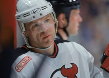 Claude Lemieux of the New Jersey Devils looks on from the wall during a game against the Dallas Stars at the Continental Airlines Arena in East Rutherford, New Jersey, on March 15, 2000.