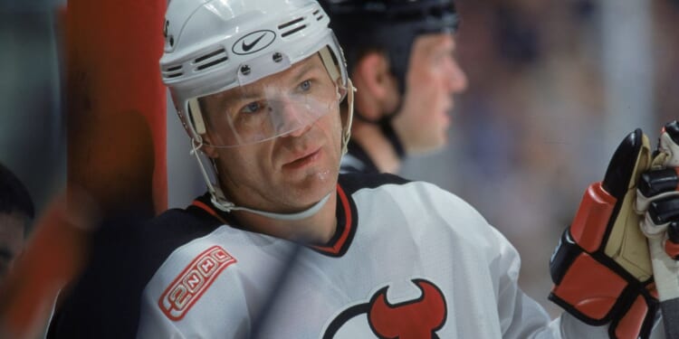 Claude Lemieux of the New Jersey Devils looks on from the wall during a game against the Dallas Stars at the Continental Airlines Arena in East Rutherford, New Jersey, on March 15, 2000.