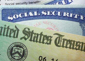 A United States Treasury government check, a tax return, and two social security cards.