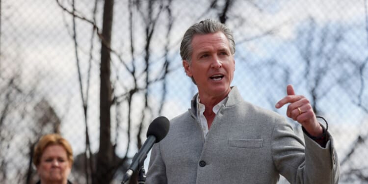 Gov. Gavin Newsom speaks at a press conference at Odyssey Charter School as work begins to remove debris from the Eaton Fire in Altadena, California.