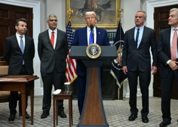 President Trump stands with administration officials such as Secretary of HHS Kennedy, FDA Commissioner Makary, and others on May 12, 2026.