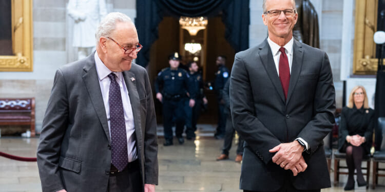 Chuck Schumer and John Thune in the Capitol.