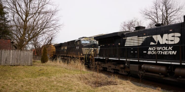 A Norfolk Southern train is en route on Feb. 14, 2023, in East Palestine, Ohio.