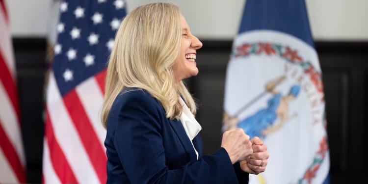 Virginia Gov. Abigail Spanberger stands smiling.