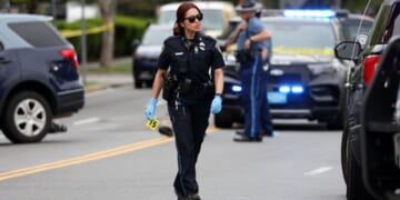 An officer walks on the scene of the Cambridge, Massachusetts incident.