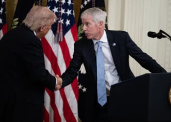 Chris Wright greets President Donald Trump