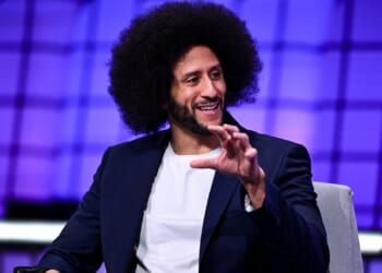 Colin Kaepernick speaking while seated