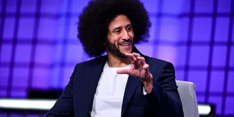 Colin Kaepernick speaking while seated